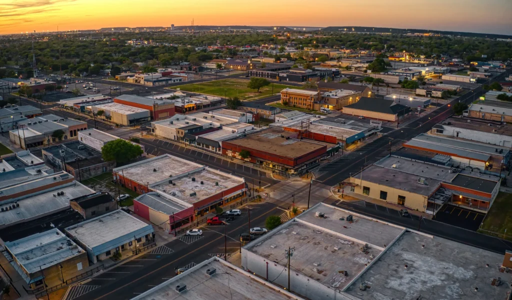 Aerial view of downtown Killeen, Texas at sunset, showing grid streets, low-rise buildings, and surrounding neighborhoods.