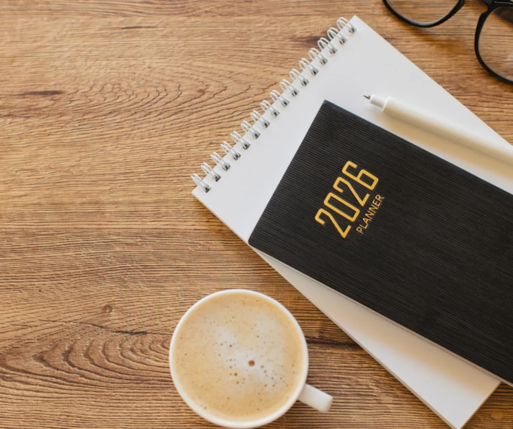 2026 planner on a desk beside a notebook, pen, and coffee—representing planning ahead for Killeen business flex space trends in 2026.